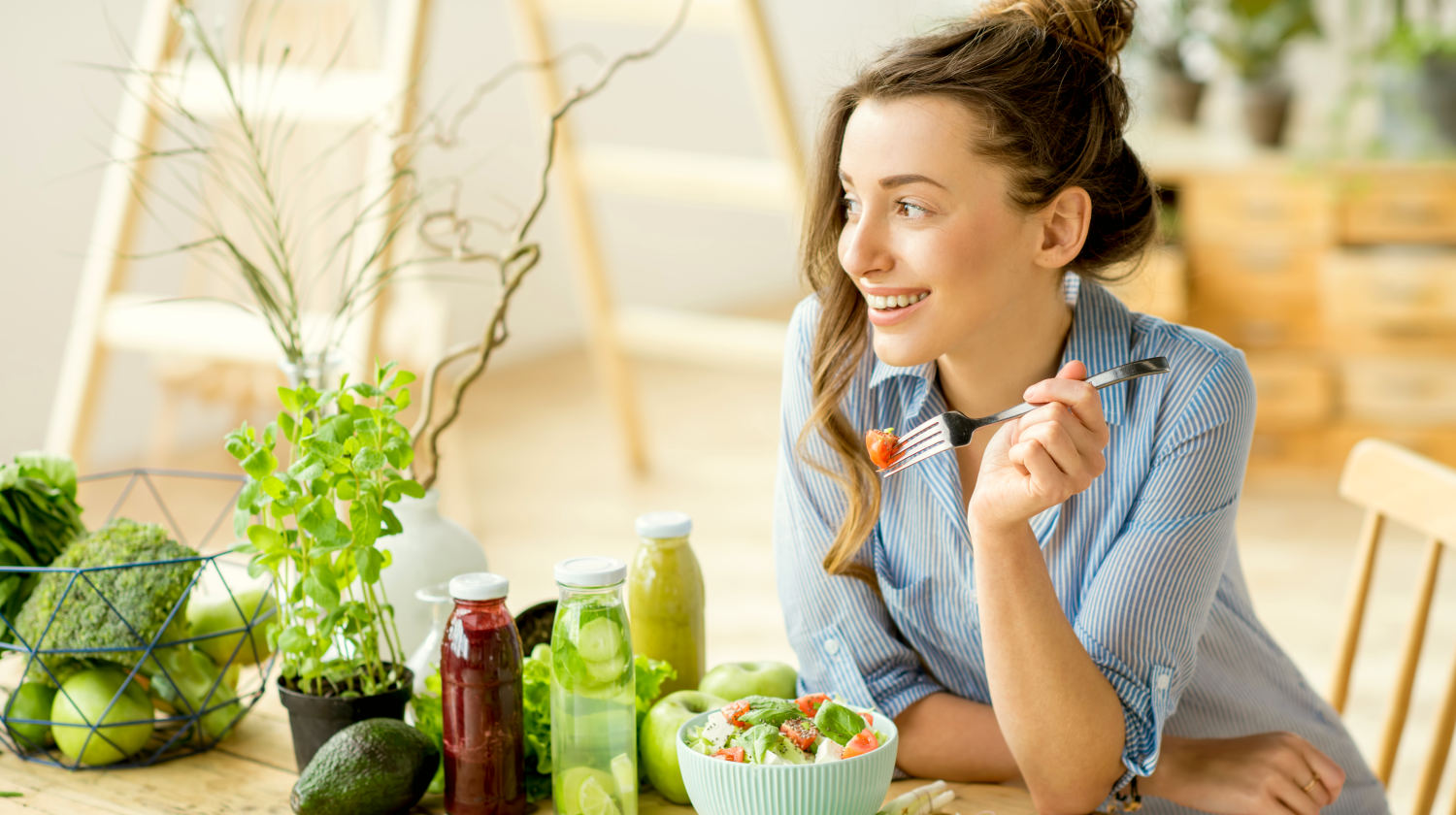 Feature | Young happy woman eating healthy salad | Everything You Need To Know About Healthy Eating